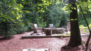 fire pit in the woods at NH property